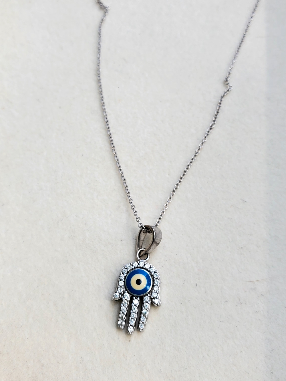 Sterling Silver Hamsa Hand Necklace with Blue Evil Eye Pendant